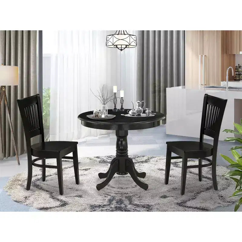 Chaises de salle à manger noires à pied central